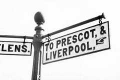 Signpost to Prescot at Portico